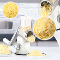 Rotary Cheese Grater with 3 Interchangeable Blades and Non-Slip Suction Base - Manual Vegetable Slicer and Nut Grinder with Included Brush Peeler - White